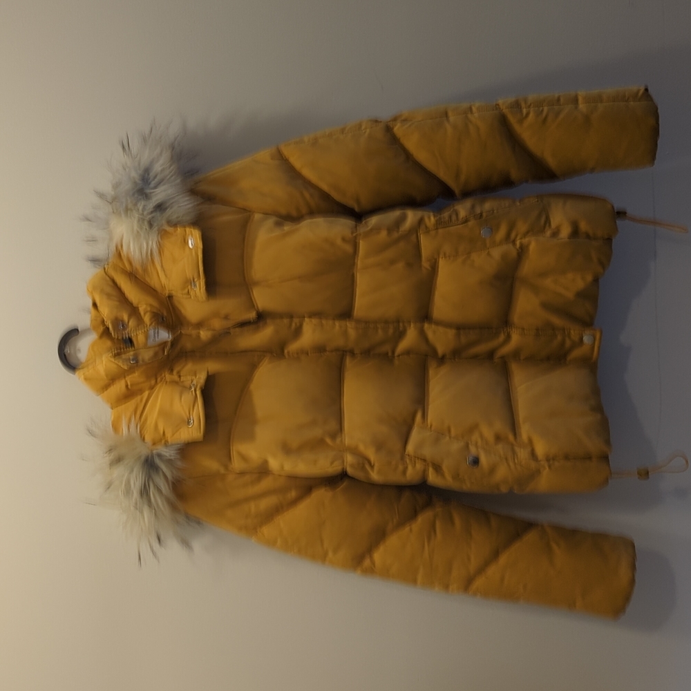 Yellowish puffy jacket with fur lined hood